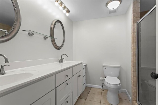 1833 Lost Mountain Rd, Powder Springs, GA 30127 - bathroom featuring a sink, tiled shower, toilet, and tile patterned floors
