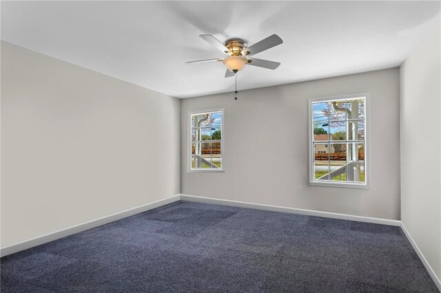 1833 Lost Mountain Rd, Powder Springs, GA 30127 - empty room with dark colored carpet, baseboards, and a ceiling fan