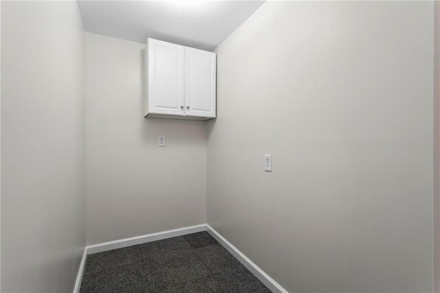 1833 Lost Mountain Rd, Powder Springs, GA 30127 - laundry room featuring baseboards and dark colored carpet