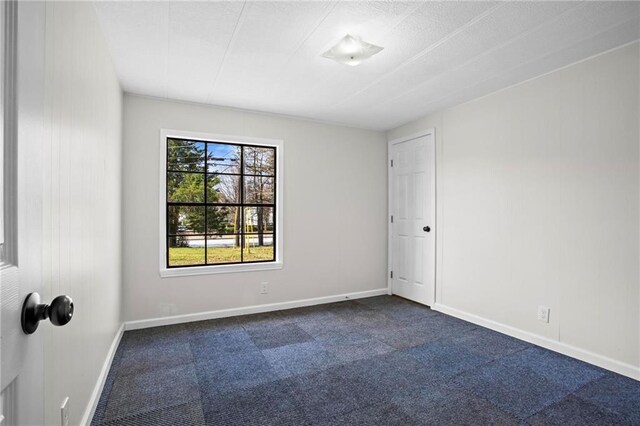 1833 Lost Mountain Rd, Powder Springs, GA 30127 - unfurnished room featuring dark carpet and baseboards