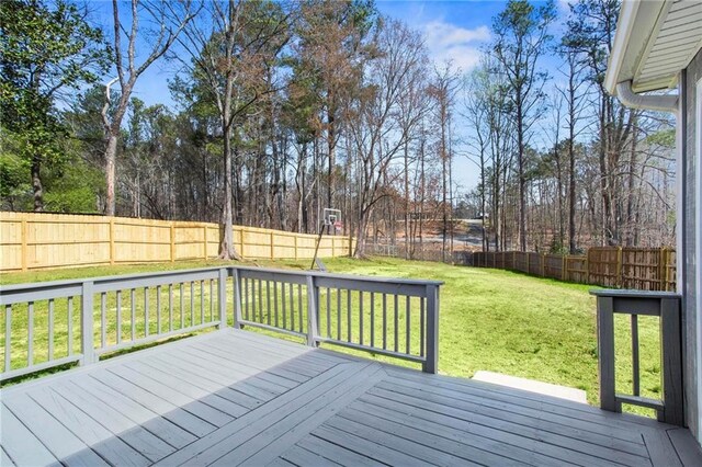 1833 Lost Mountain Rd, Powder Springs, GA 30127 - wooden deck featuring a lawn and a fenced backyard