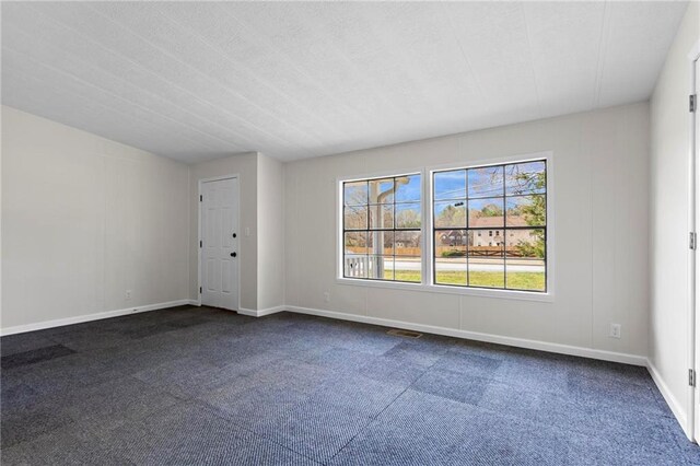 1833 Lost Mountain Rd, Powder Springs, GA 30127 - empty room featuring dark carpet and baseboards