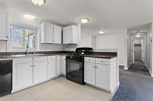 1833 Lost Mountain Rd, Powder Springs, GA 30127 - kitchen with white cabinetry, black appliances, a peninsula, and a sink