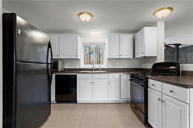 1833 Lost Mountain Rd, Powder Springs, GA 30127 - kitchen featuring black appliances, white cabinets, dark countertops, and a sink