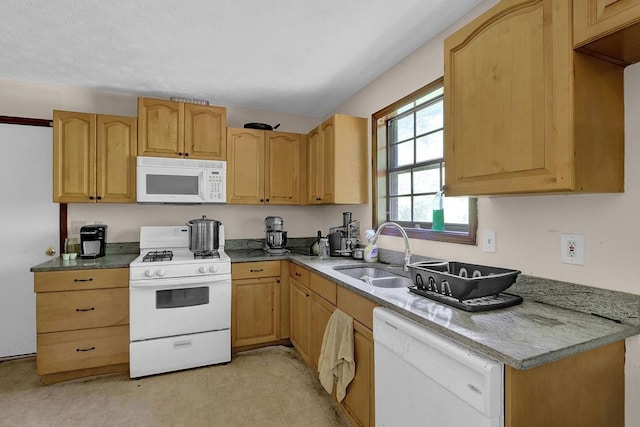 504 Rock Meadow Dr, Stone Mountain, GA 30088 - kitchen with white appliances and light brown cabinetry