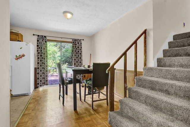 504 Rock Meadow Dr, Stone Mountain, GA 30088 - dining area featuring stairs and a textured ceiling