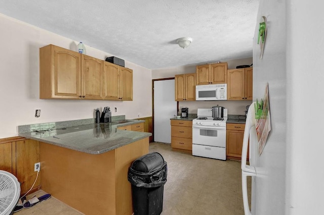 504 Rock Meadow Dr, Stone Mountain, GA 30088 - kitchen featuring white appliances, a peninsula, a breakfast bar, a textured ceiling, and light flooring