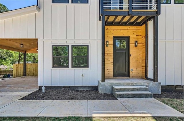 entrance to property with a balcony