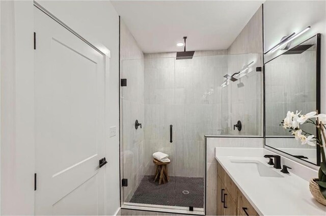 bathroom featuring vanity and walk in shower