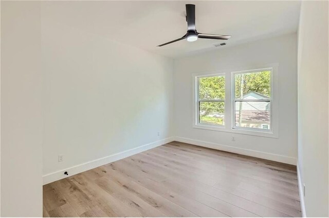 unfurnished room featuring ceiling fan and light hardwood / wood-style floors