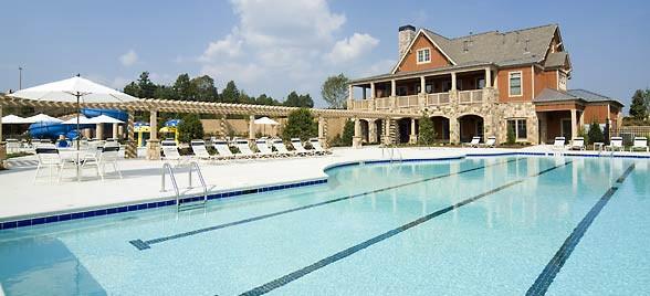 community pool with a patio area