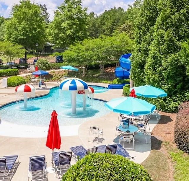 view of pool featuring a patio