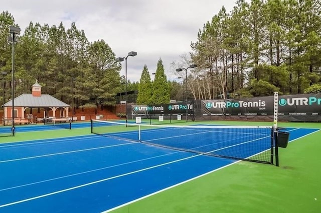 view of sport court featuring fence