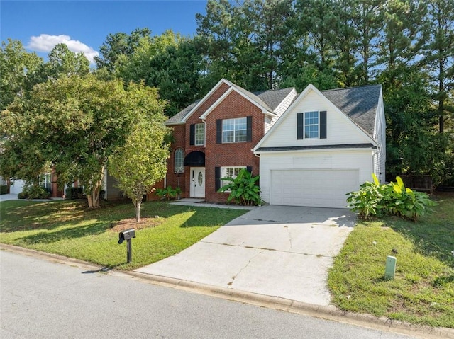 view of front of property with a front yard and a garage