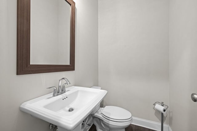 bathroom with toilet and sink