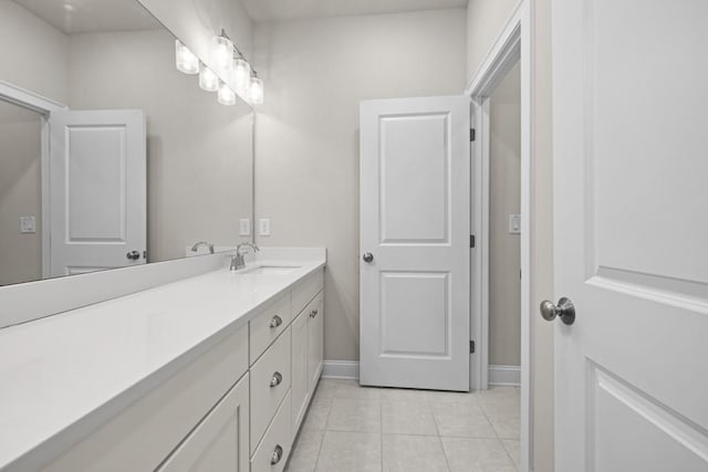 bathroom with vanity and tile patterned floors