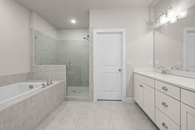 bathroom with plus walk in shower, tile patterned floors, and vanity