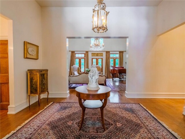 interior space featuring a chandelier and hardwood / wood-style flooring