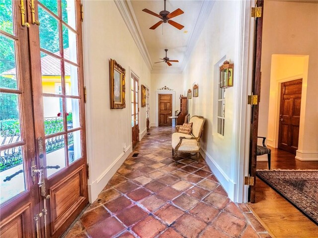 hallway with crown molding, french doors, dark hardwood / wood-style flooring, and plenty of natural light