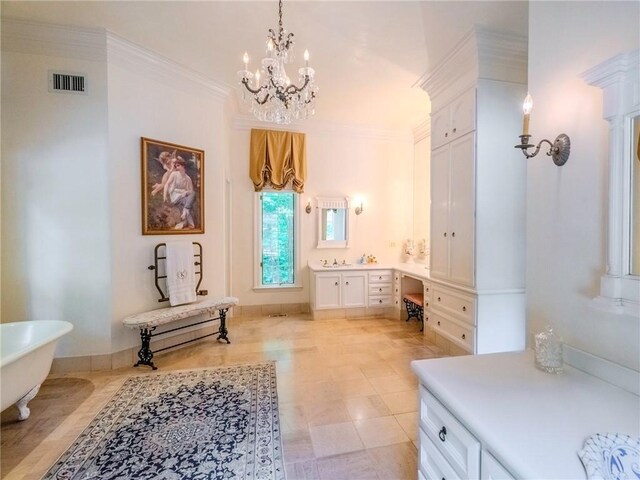 interior space with a chandelier and ornamental molding