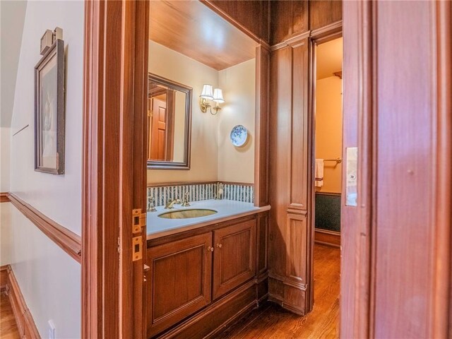 bathroom featuring vanity and hardwood / wood-style floors