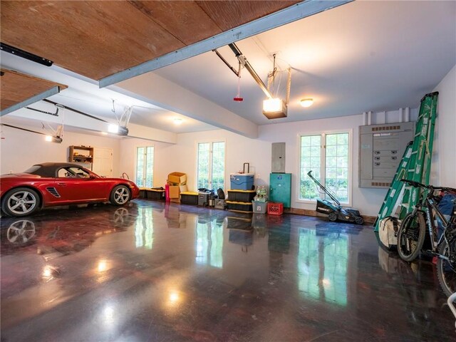 garage featuring a garage door opener and electric panel