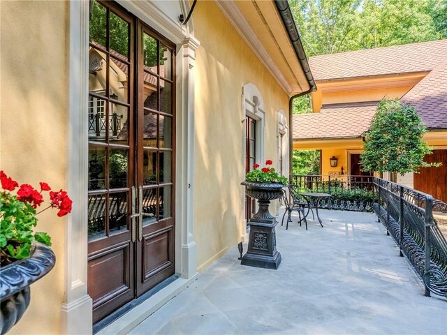 view of patio / terrace with a porch and french doors