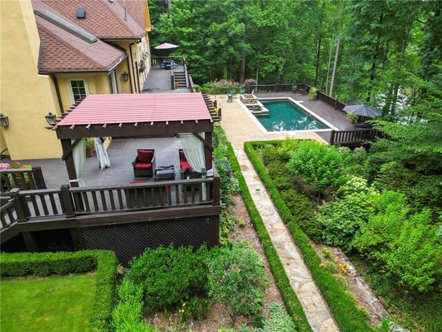 view of swimming pool featuring a wooden deck