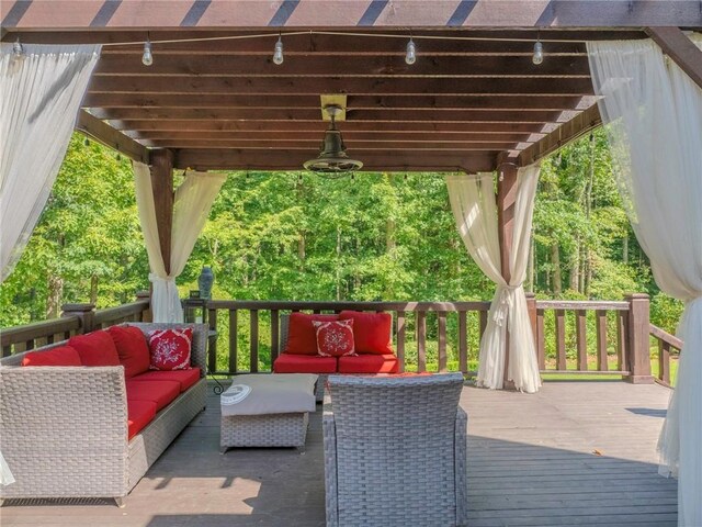 deck featuring a pergola and outdoor lounge area