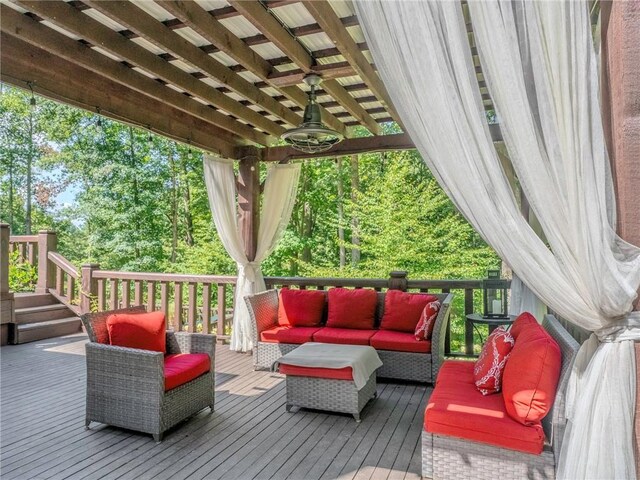 wooden terrace featuring an outdoor hangout area