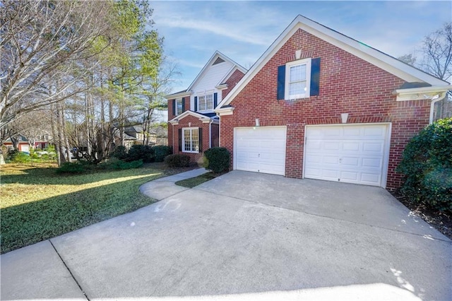 view of property featuring a garage and a front yard