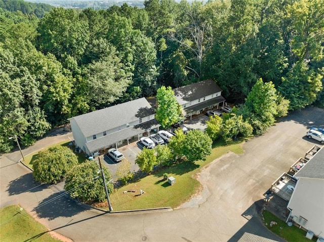 drone / aerial view featuring a view of trees