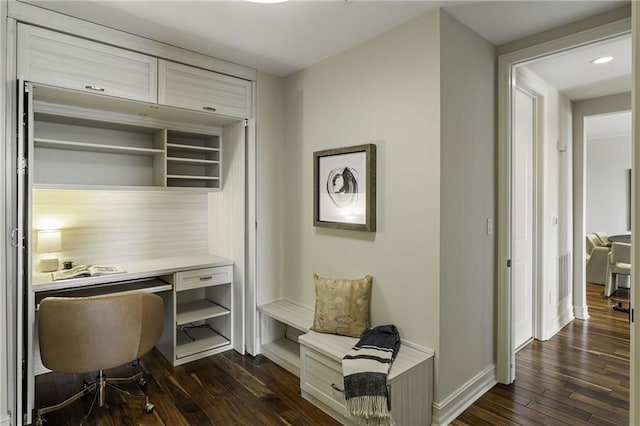 home office with visible vents, dark wood-type flooring, and baseboards