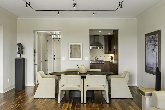 dining space with crown molding, baseboards, and dark wood-style flooring