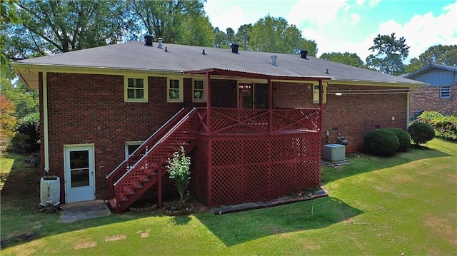 10 Montre Cir, Silver Creek, GA 30173 - back of property with brick siding, a yard, and stairway