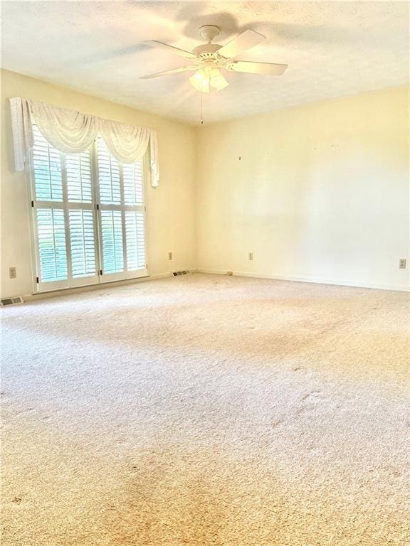 10 Montre Cir, Silver Creek, GA 30173 - unfurnished room with a ceiling fan, light carpet, and a textured ceiling