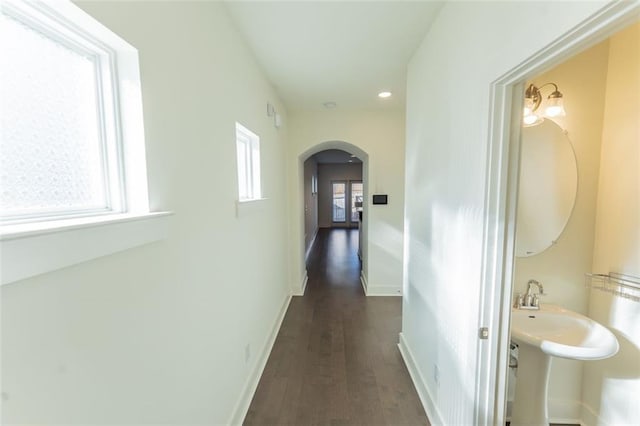 corridor with dark hardwood / wood-style floors