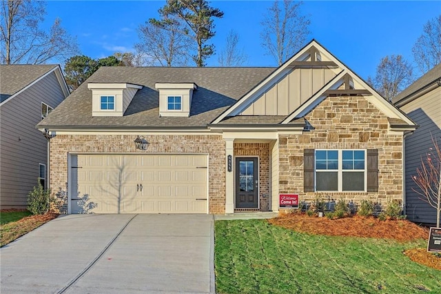 craftsman house featuring a front yard and a garage