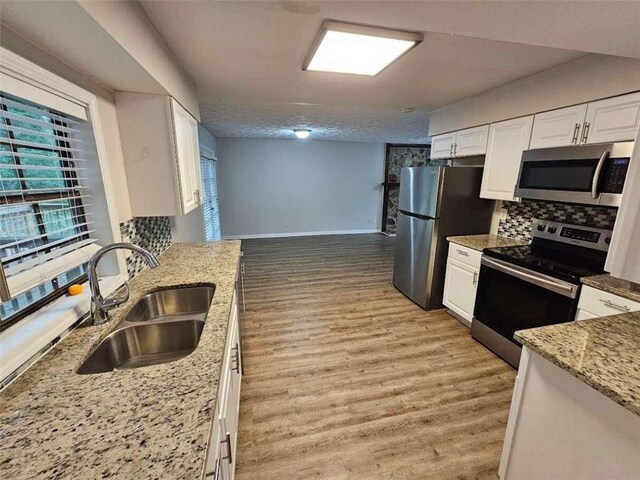 full bathroom featuring tiled shower / bath, vanity, toilet, and hardwood / wood-style flooring