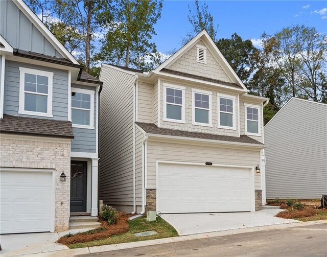 706 Smokey Quartz Way, Kennesaw, GA 30144 - craftsman house featuring stone siding, driveway, an attached garage, and roof with shingles