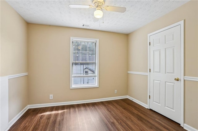 1039 Megan Ct, Sugar Hill, GA 30518 - spare room with wood finished floors, a textured ceiling, ceiling fan, and baseboards