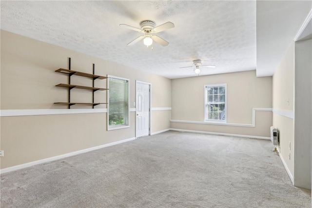 1039 Megan Ct, Sugar Hill, GA 30518 - carpeted empty room with ceiling fan, a textured ceiling, and baseboards