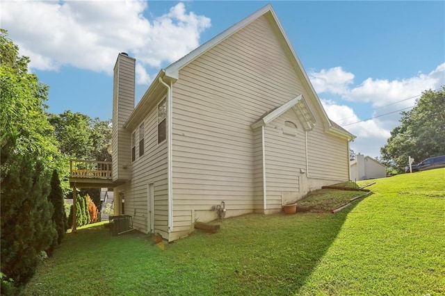 1039 Megan Ct, Sugar Hill, GA 30518 - view of side of home with a chimney, a lawn, and a deck