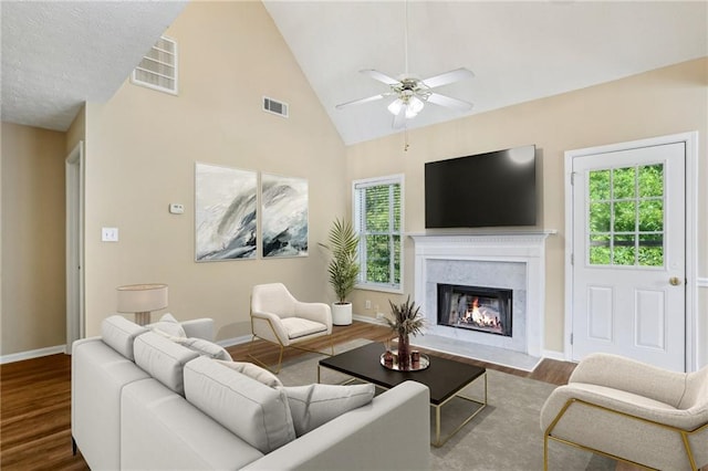 1039 Megan Ct, Sugar Hill, GA 30518 - living room featuring plenty of natural light, wood finished floors, baseboards, and high vaulted ceiling