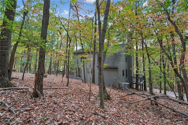 view of side of property with central AC