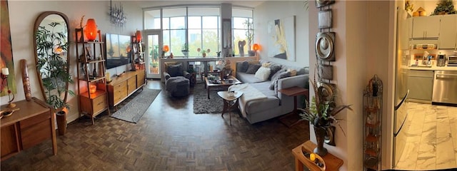 sitting room featuring dark parquet flooring