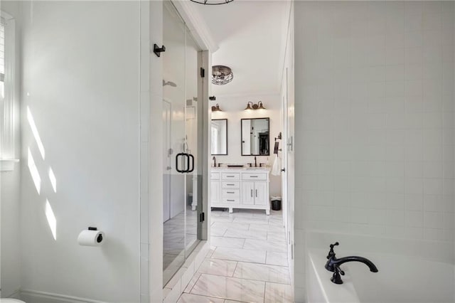 bathroom featuring a shower stall, vanity, marble finish floor, and a garden tub