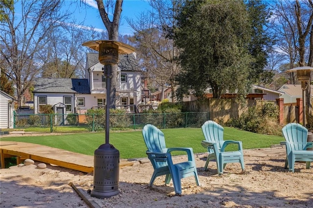 exterior space with a balcony and fence