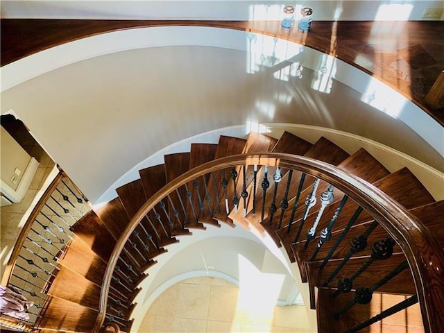 stairway with tile patterned flooring