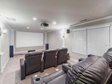 home theater featuring light colored carpet and ornamental molding